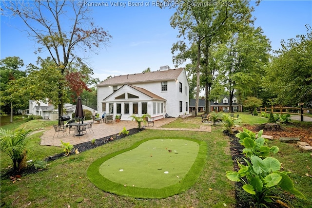 back of house with a patio