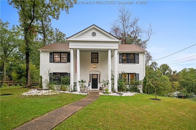 greek revival house featuring a front lawn