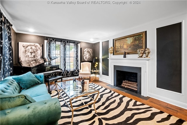 living room featuring wood-type flooring and crown molding