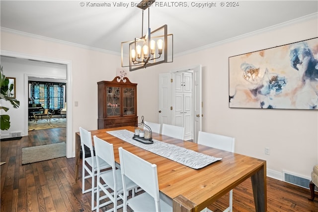 dining area with dark hardwood / wood-style floors, ornamental molding, and a notable chandelier