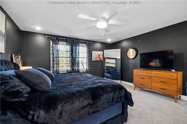 carpeted bedroom with ceiling fan