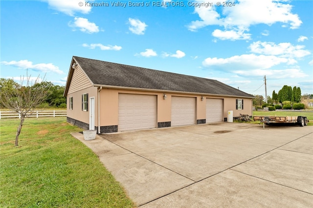 garage with a yard