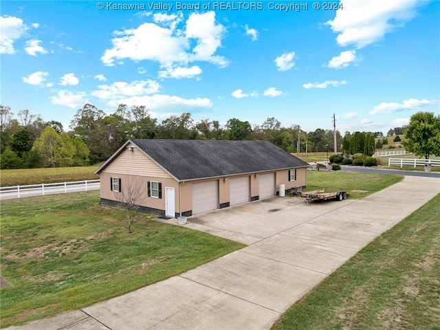 view of front of home featuring a garage and a front lawn