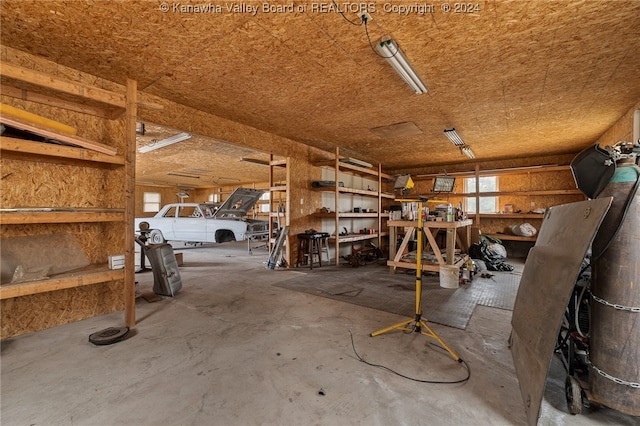 interior space with a workshop area and concrete floors