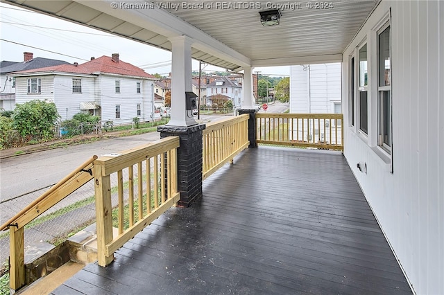 wooden deck featuring covered porch