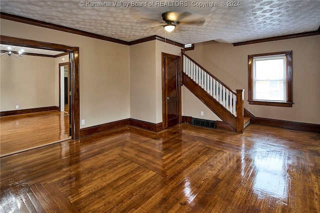 spare room featuring a textured ceiling, crown molding, hardwood / wood-style floors, and ceiling fan