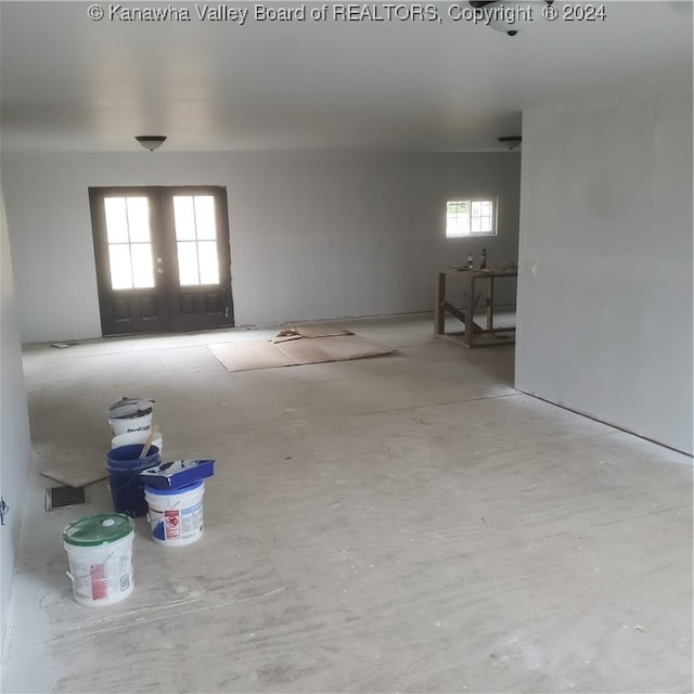 spare room featuring french doors