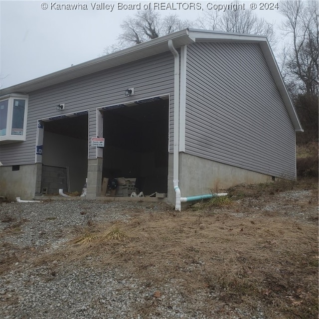 view of side of property featuring a garage