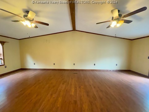 empty room with ornamental molding, lofted ceiling with beams, hardwood / wood-style floors, and ceiling fan