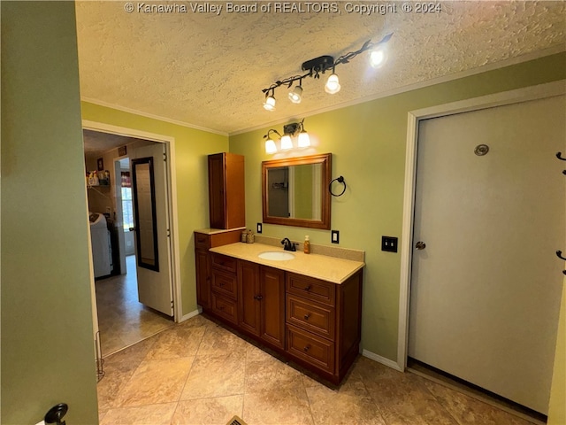 bathroom featuring vanity, crown molding, a textured ceiling, and tile patterned floors