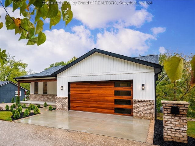 view of front of property featuring a garage and a porch