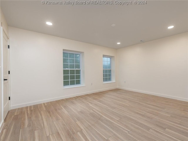 spare room featuring light wood-type flooring