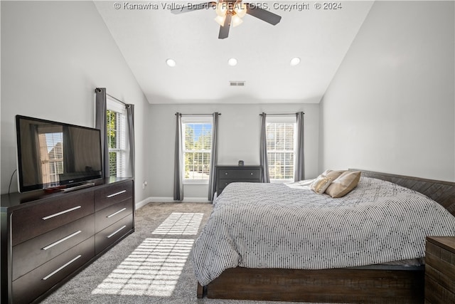 carpeted bedroom with ceiling fan and lofted ceiling