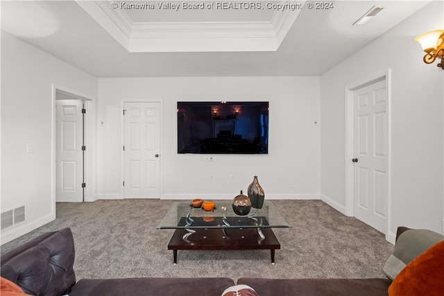 living room featuring a raised ceiling, carpet floors, and crown molding