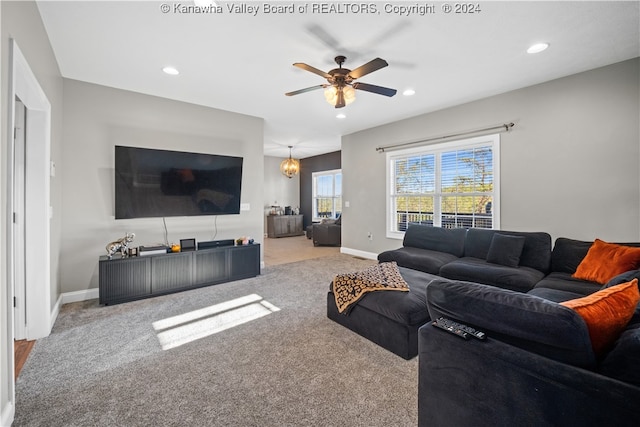 carpeted living room featuring ceiling fan