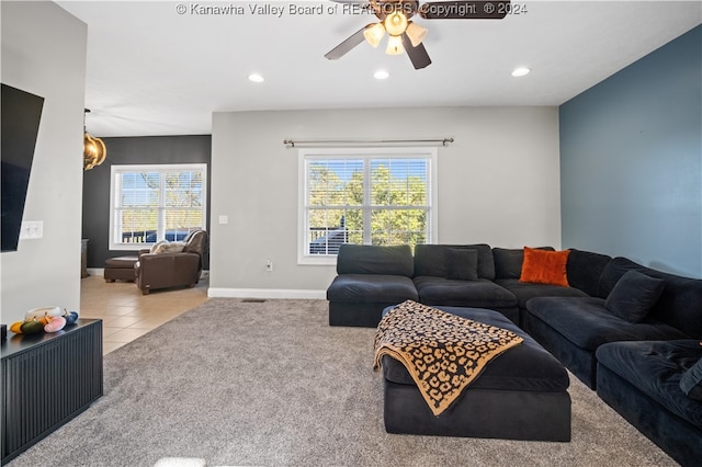 carpeted living room featuring ceiling fan and plenty of natural light