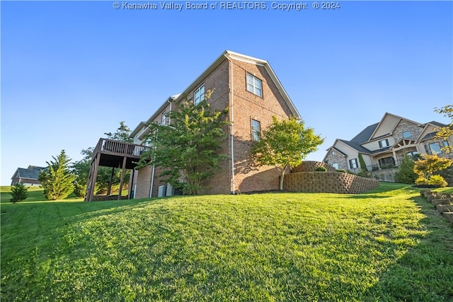 view of property exterior featuring a lawn