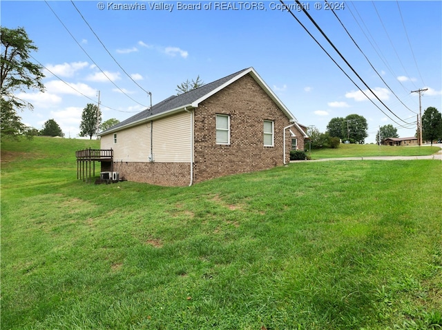 view of home's exterior with a lawn