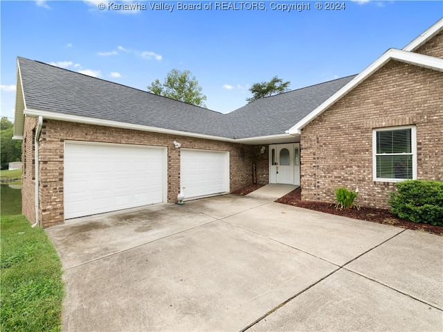 ranch-style home with a garage