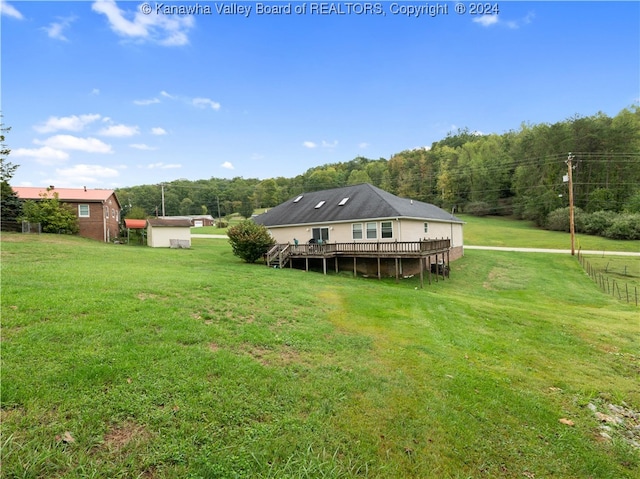 view of yard with a wooden deck