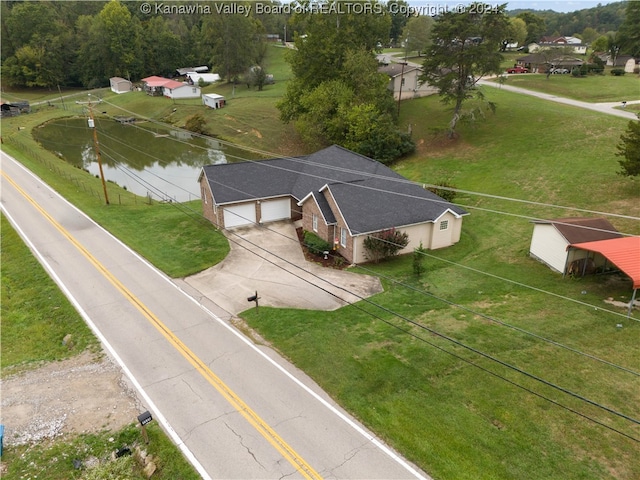 drone / aerial view featuring a water view