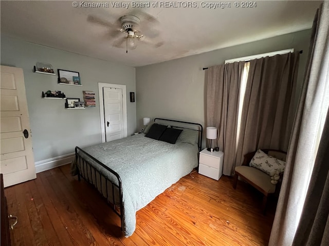 bedroom featuring ceiling fan and wood-type flooring