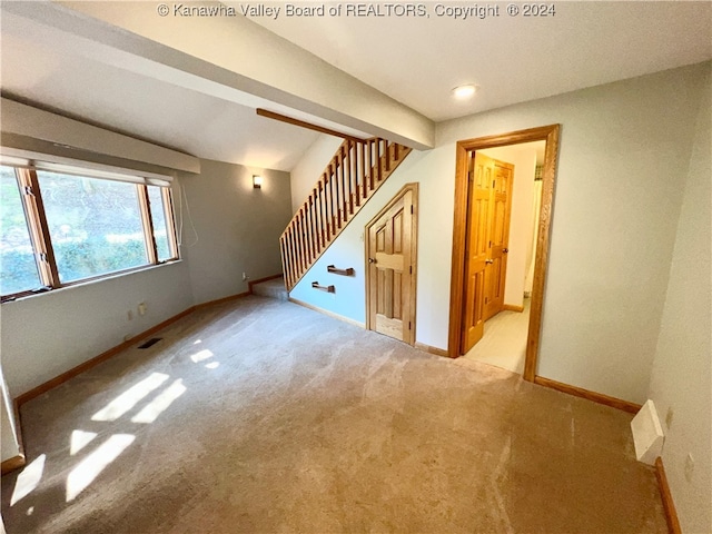 unfurnished living room with light carpet