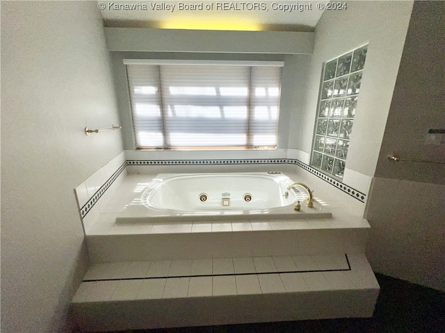 bathroom with tiled tub