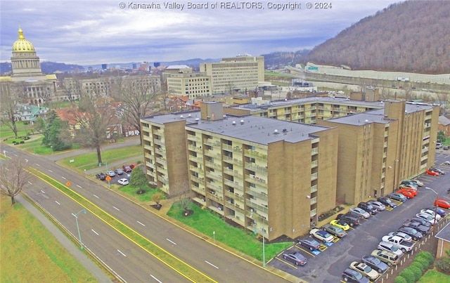 birds eye view of property with a mountain view