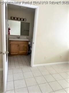 bathroom with vanity and tile patterned floors