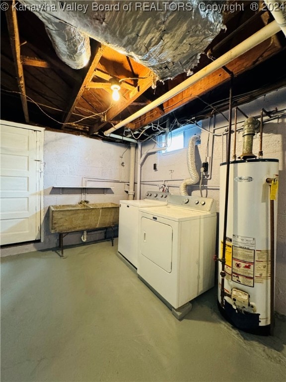 basement featuring gas water heater and washing machine and clothes dryer