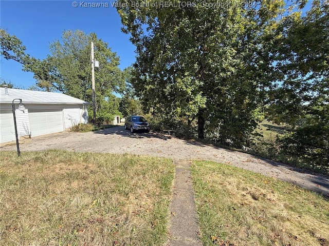 view of yard featuring a garage