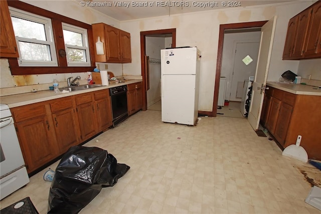 kitchen with crown molding, sink, and white appliances