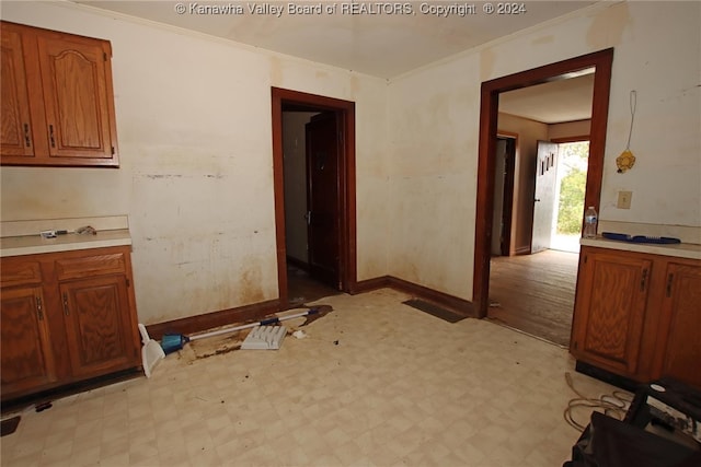 interior space with crown molding