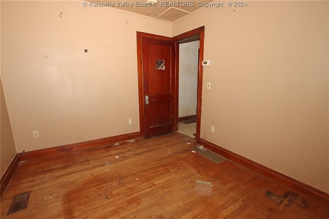 spare room with hardwood / wood-style floors