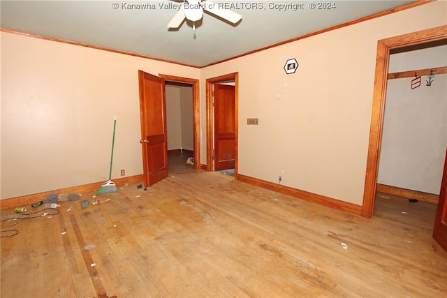 unfurnished bedroom with ornamental molding, light hardwood / wood-style floors, and ceiling fan