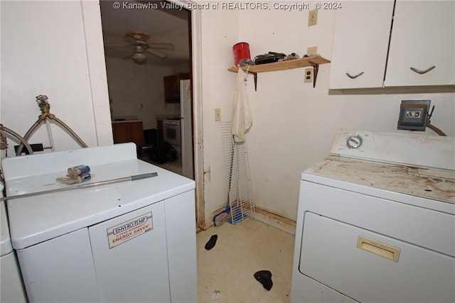 clothes washing area featuring ceiling fan, cabinets, and washing machine and clothes dryer