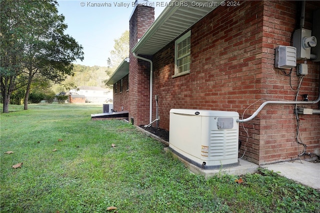 view of property exterior with a lawn and central AC