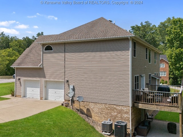 view of property exterior with a garage, cooling unit, and a deck