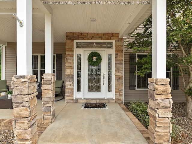 property entrance with covered porch