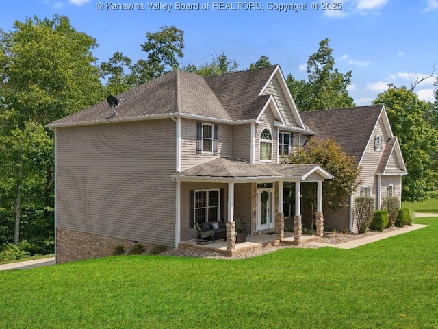 view of front of home featuring a front lawn and a porch