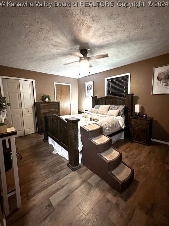 bedroom featuring wood-type flooring, ceiling fan, a closet, and a textured ceiling