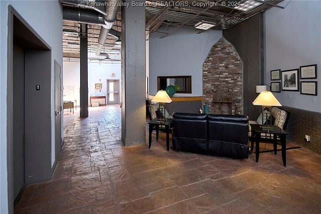 living room with a towering ceiling