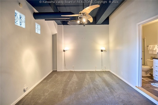 interior space with ceiling fan and carpet