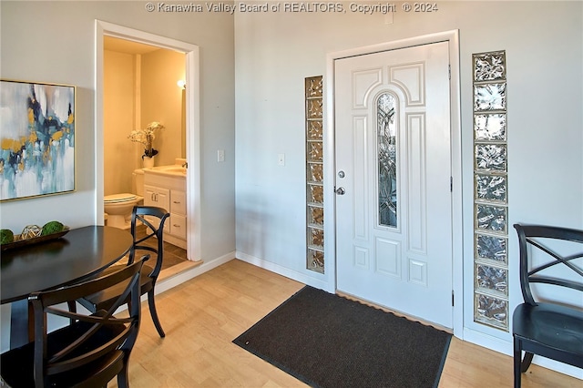 entrance foyer featuring light hardwood / wood-style flooring and sink