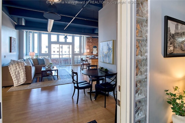 dining space featuring wood-type flooring