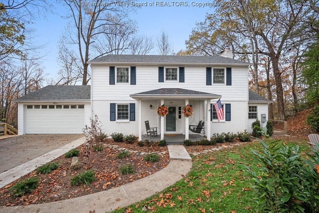 view of front of house featuring covered porch and a garage