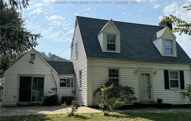 back of property with central AC unit