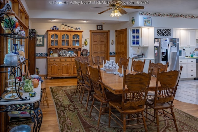 dining space with light hardwood / wood-style floors and ceiling fan