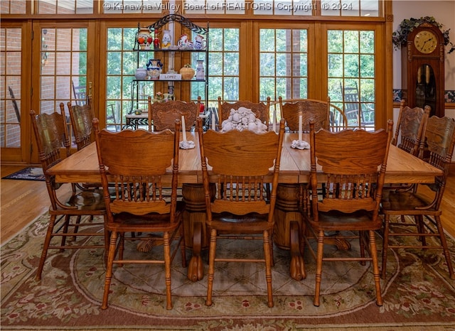 dining space with hardwood / wood-style flooring